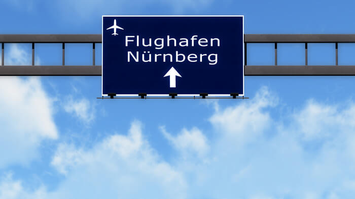 A motorway sign pointing in the direction of Nuremberg Airport