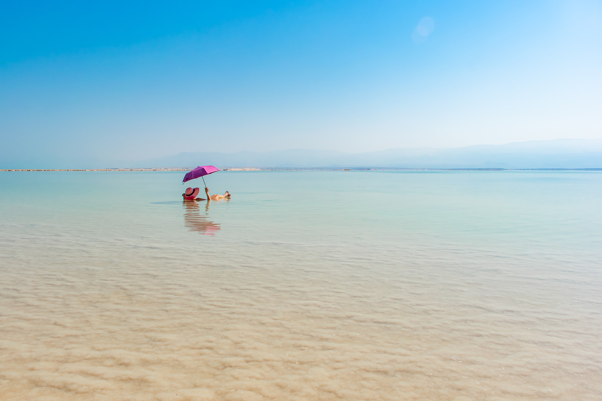 Woman lying in the sea and relaxing