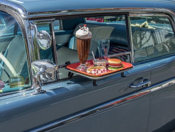 Tray with meals at an open car window