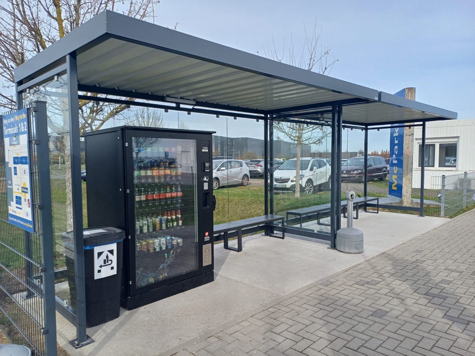 McParking's covered waiting area with vending machines