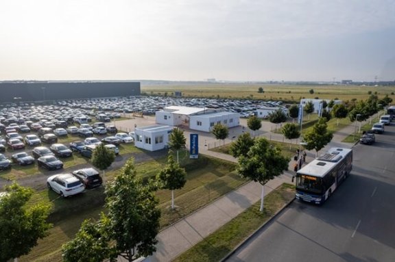 A drone shot of the car park with the shuttle bus in front of it