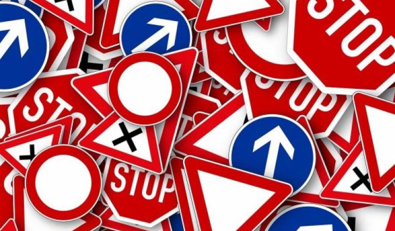 Street signs stacked on top of each other