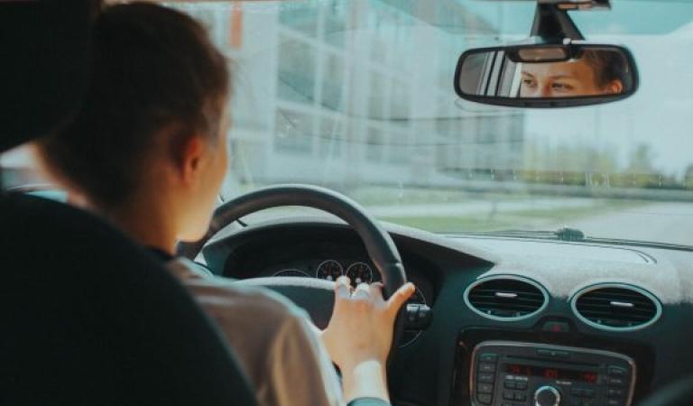 Woman behind the wheel while driving