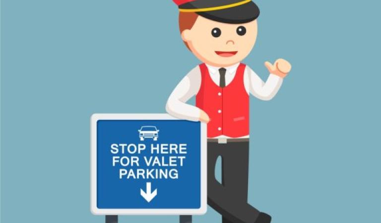 Obsluha parkoviště s obsluhou před značkou pro vyzvednutí vozu